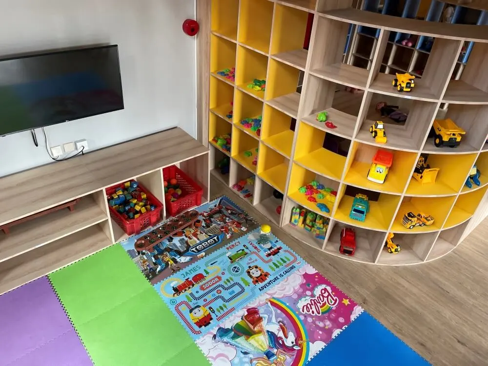 Interior of the Kupu-Kupu Kids Club at Bali Dynasty Resort, with activities and play areas across two floors