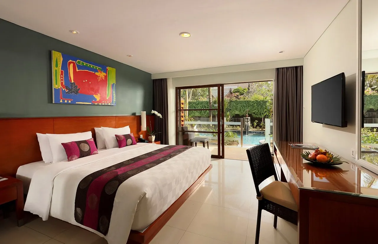 Terrace access to the lagoon pool, with a child safety gate leading directly to the water
