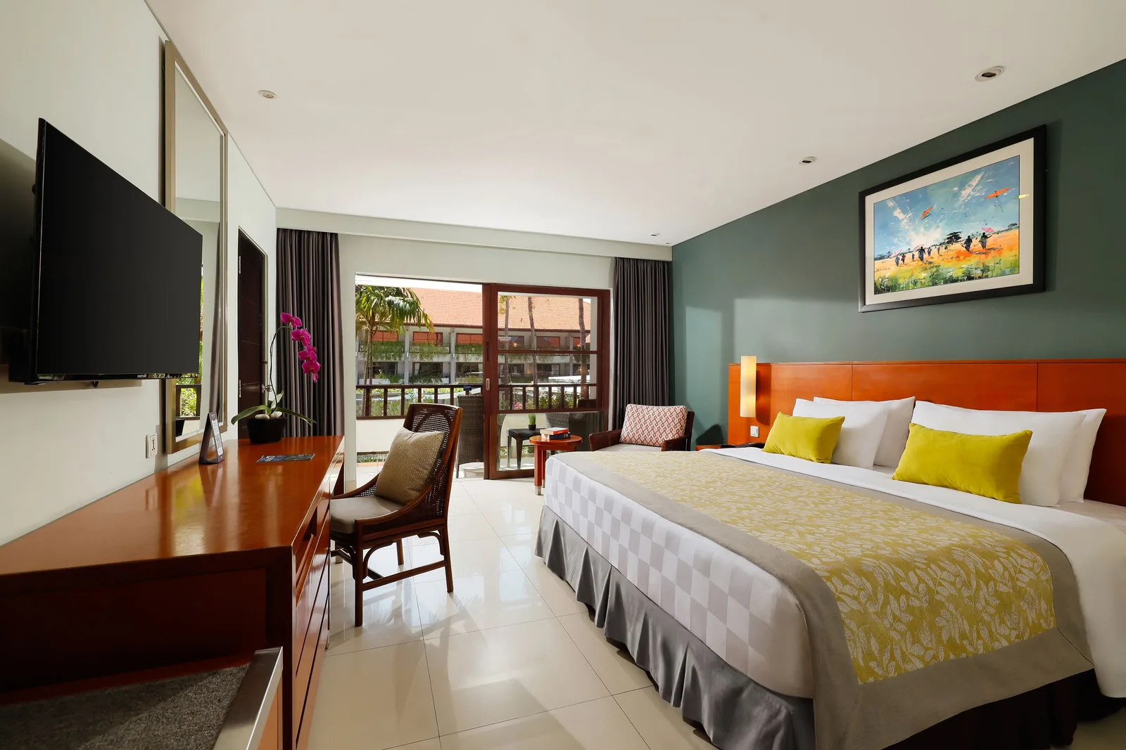 A family room with a private terrace looking over the main pool