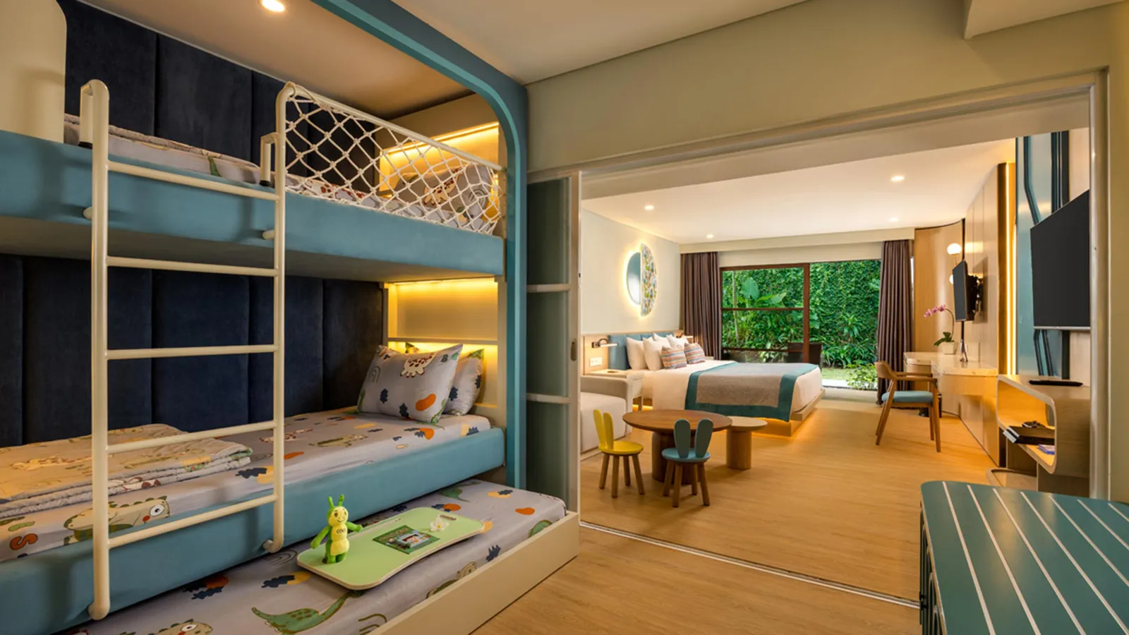 A bright family suite with extra living space and bunk beds for the children