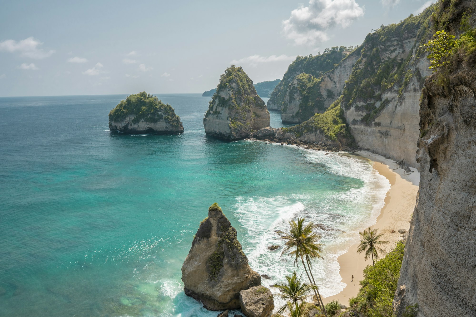 Turquoise water against the cliffs of the Bali coastline